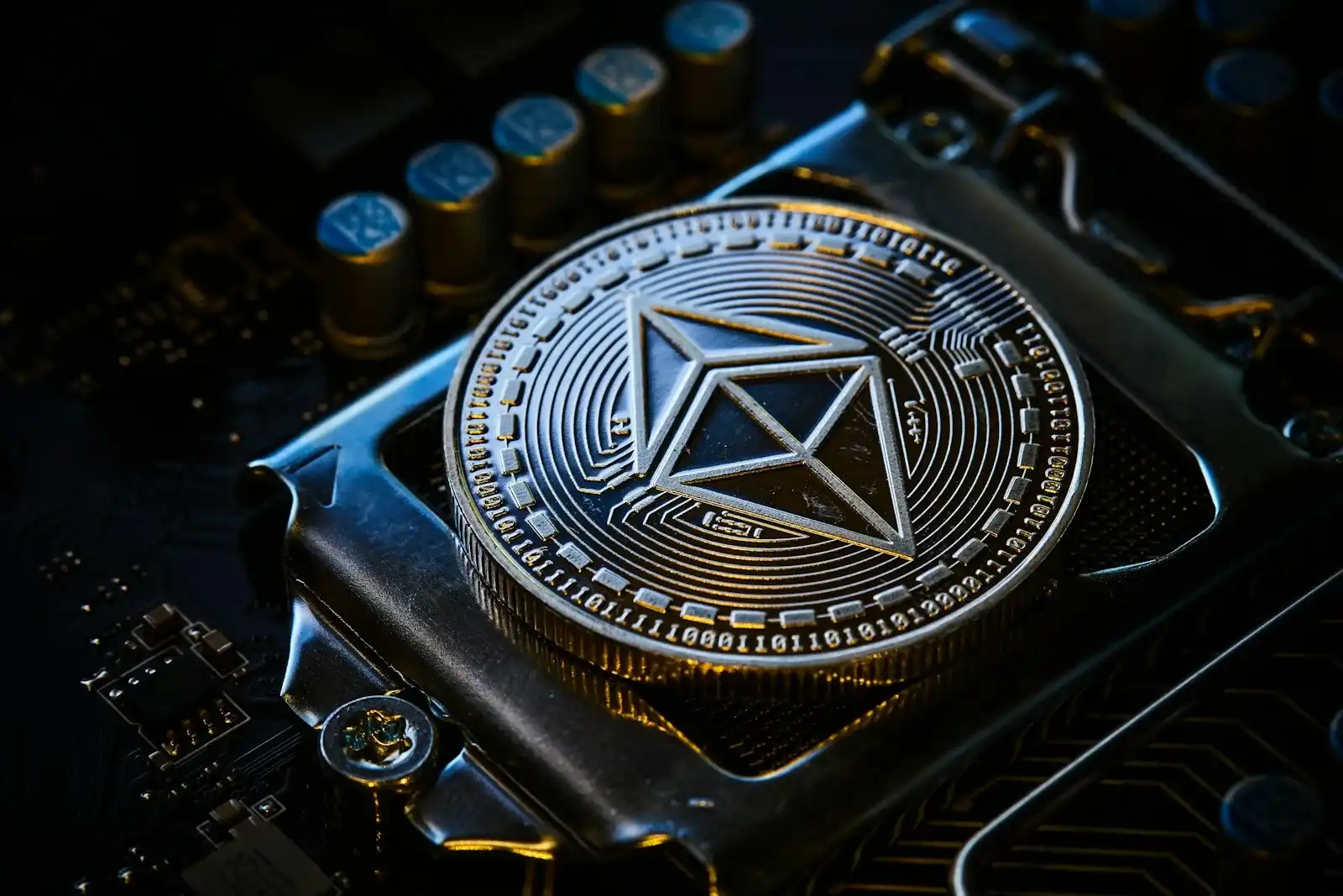 Ethereum coin resting on a computer motherboard chip