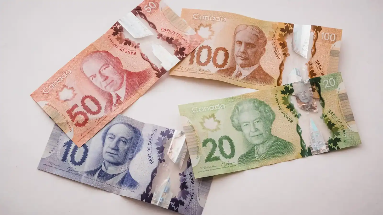 Fanned Canadian ten, twenty, fifty, and one hundred dollar bills